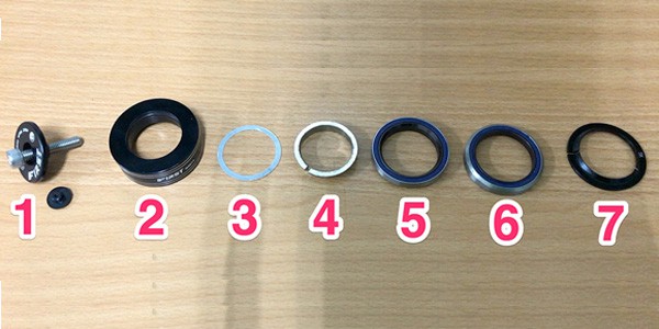 mtb headset parts laid out ready to assemble