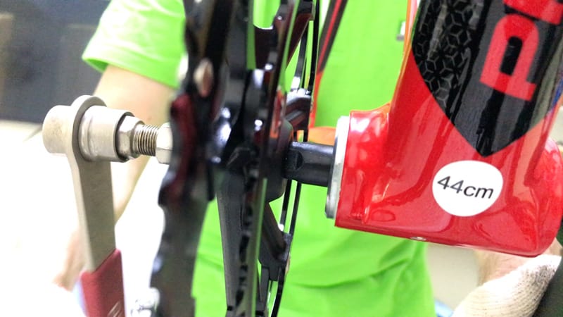 socket wrench removing crank from spindle